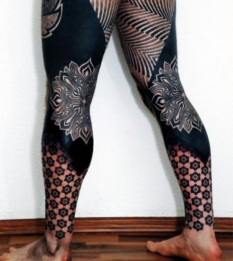 Stunning designed and painted multicolored tribal ornaments tattoo on whole legs