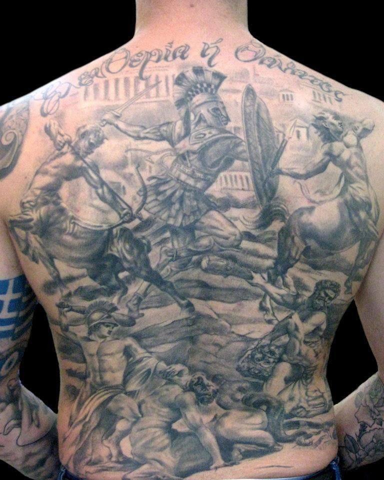 Stunning designed black and white antic Centaurus fight tattoo on whole back with lettering