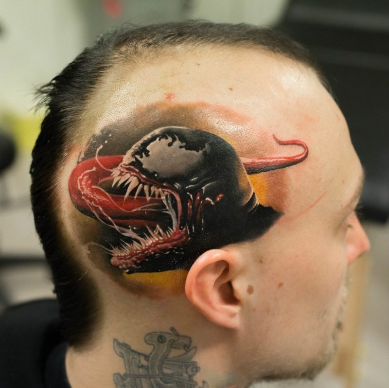 Stunning detailed and colored little Venom head tattoo