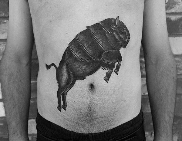Stunning looking black ink belly tattoo of jumping grunting ox