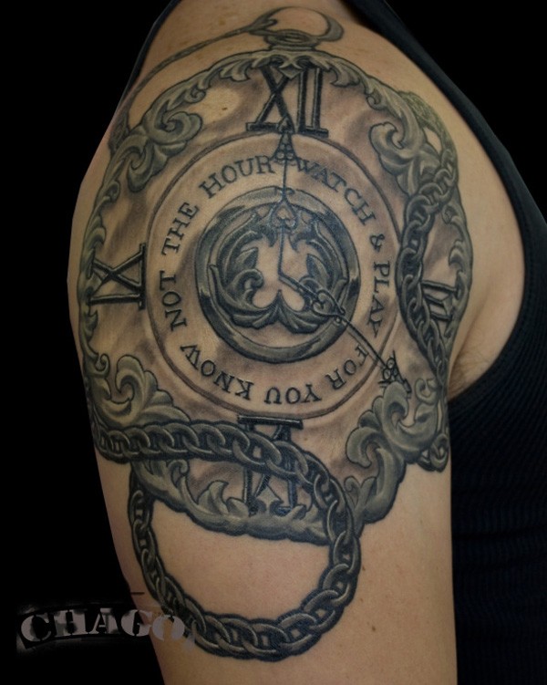 Stunning looking colored old watch tattoo on shoulder