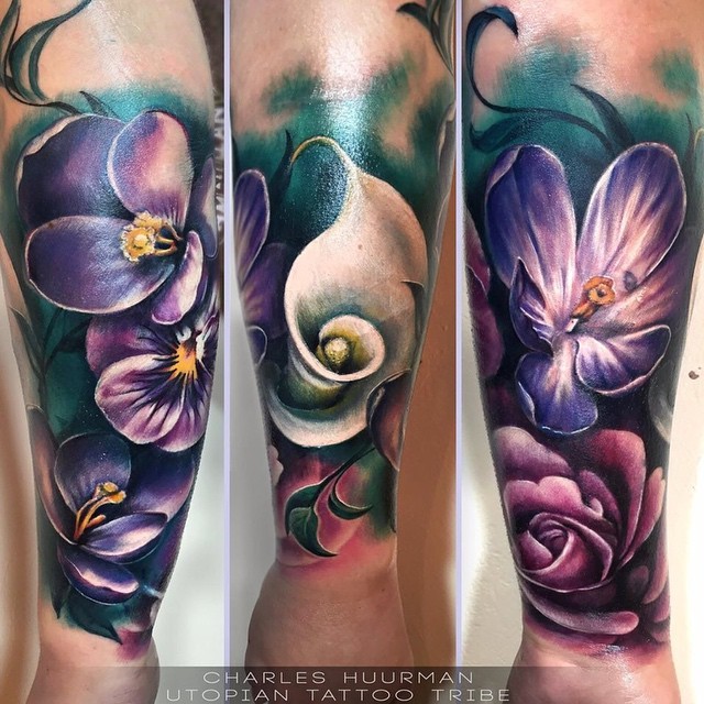 Stunning multicolored forearm tattoo of beautiful flowers