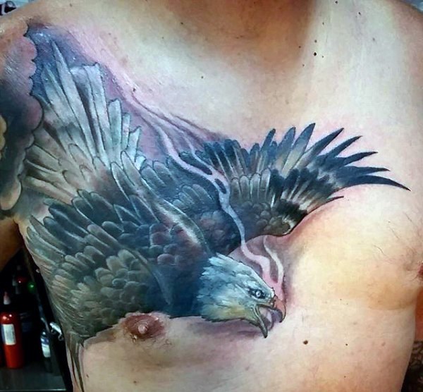 Stunning painted and colored detailed flying eagle tattoo on chest