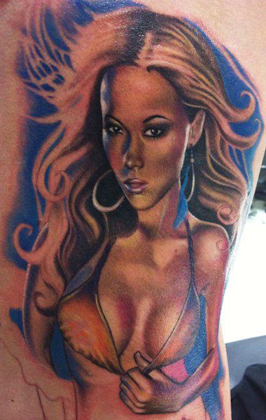 Stunning sexy looking colored tattoo of seductive woman