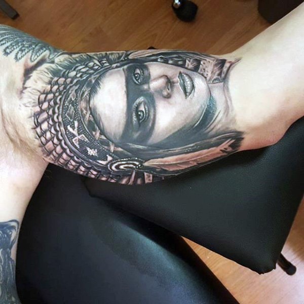 Stunning very detailed black ink Indian  woman tattoo on biceps