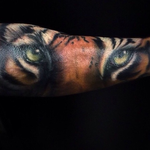 Stunning very detailed natural colored sleeve tattoo of tiger face
