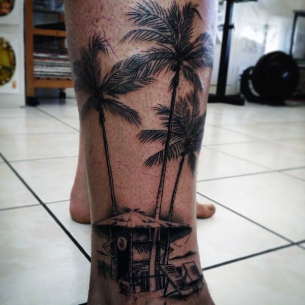 Stunning very realistic black ink palm trees tattoo on ankle