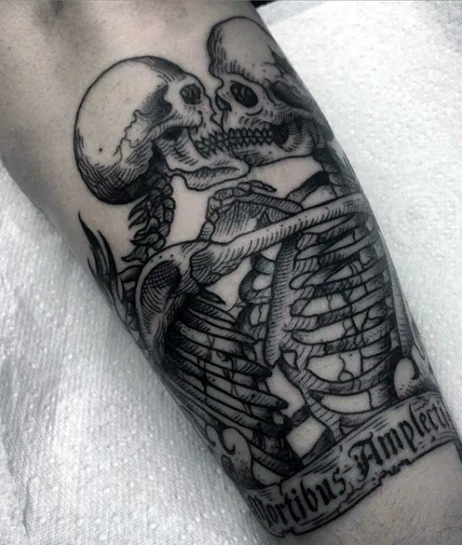 Stunning vintage style painted black and white kissing skeleton couple tattoo on arm