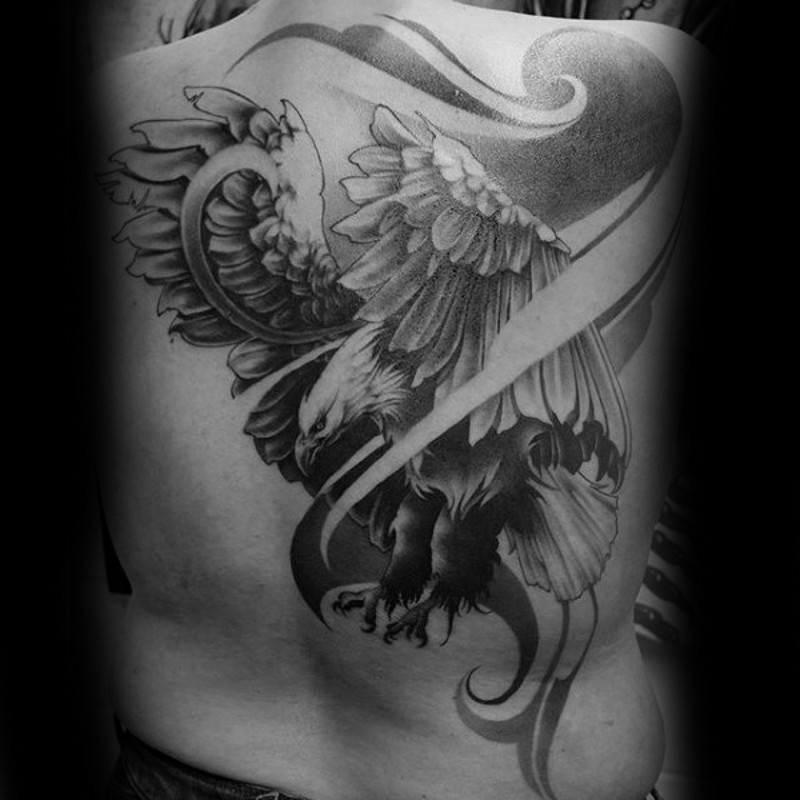 Stylish black and white whole back tattoo of flying eagle