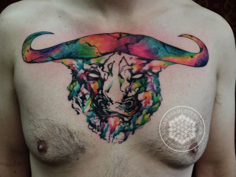 Stylish multicolored abstract style chest tattoo on bulls head