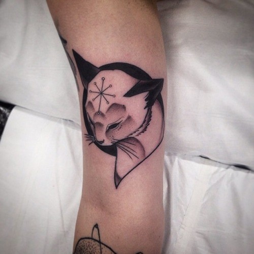 Stylized black cat tattoo by Pari Corbitt