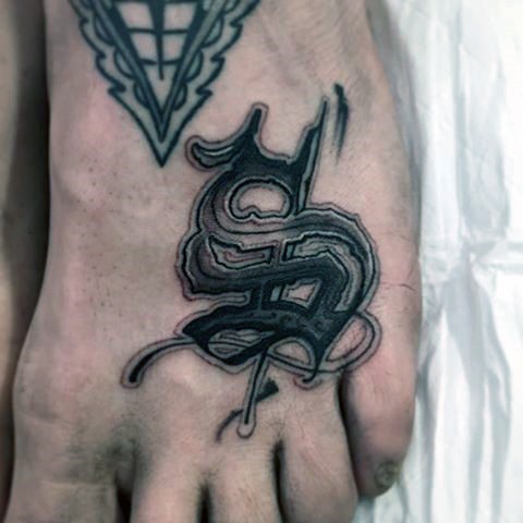 Stylized special symbol tattoo on foot