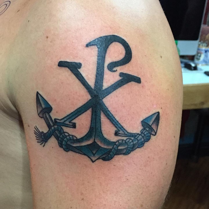 Stylized with anchor and rope religious shoulder tattoo of Christ monogram Chi Rho