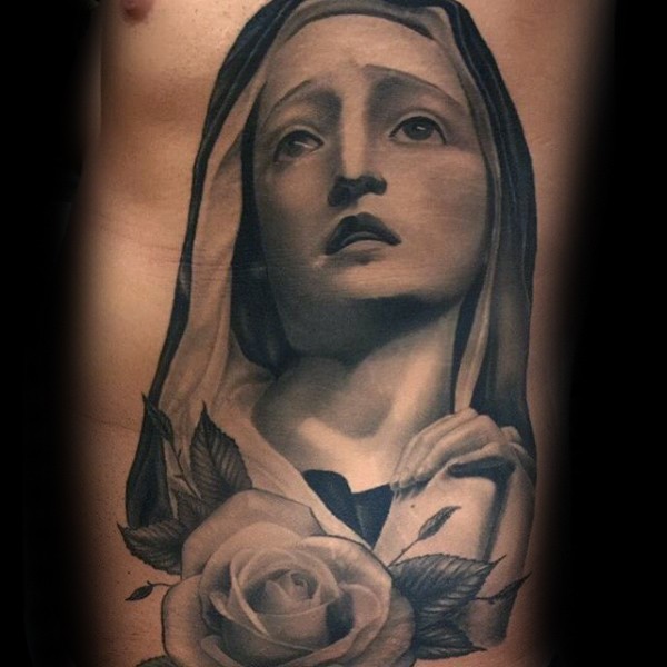 Suffering Virgin Mary religious gray ink realistic tattoo on man's side with rose flower