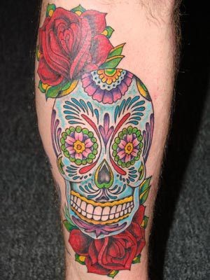 Sugar skull and red roses tattoo