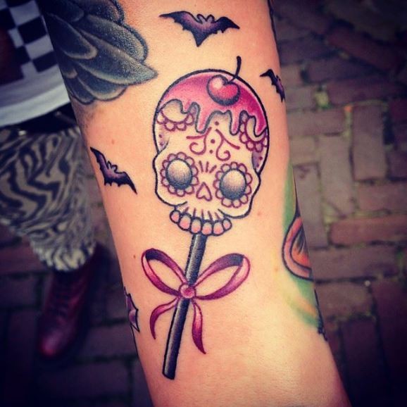 Sugar skull with a cherry on a stick tattoo