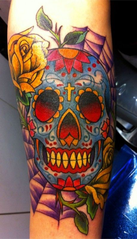 Sugar skull with yellow rose tattoo