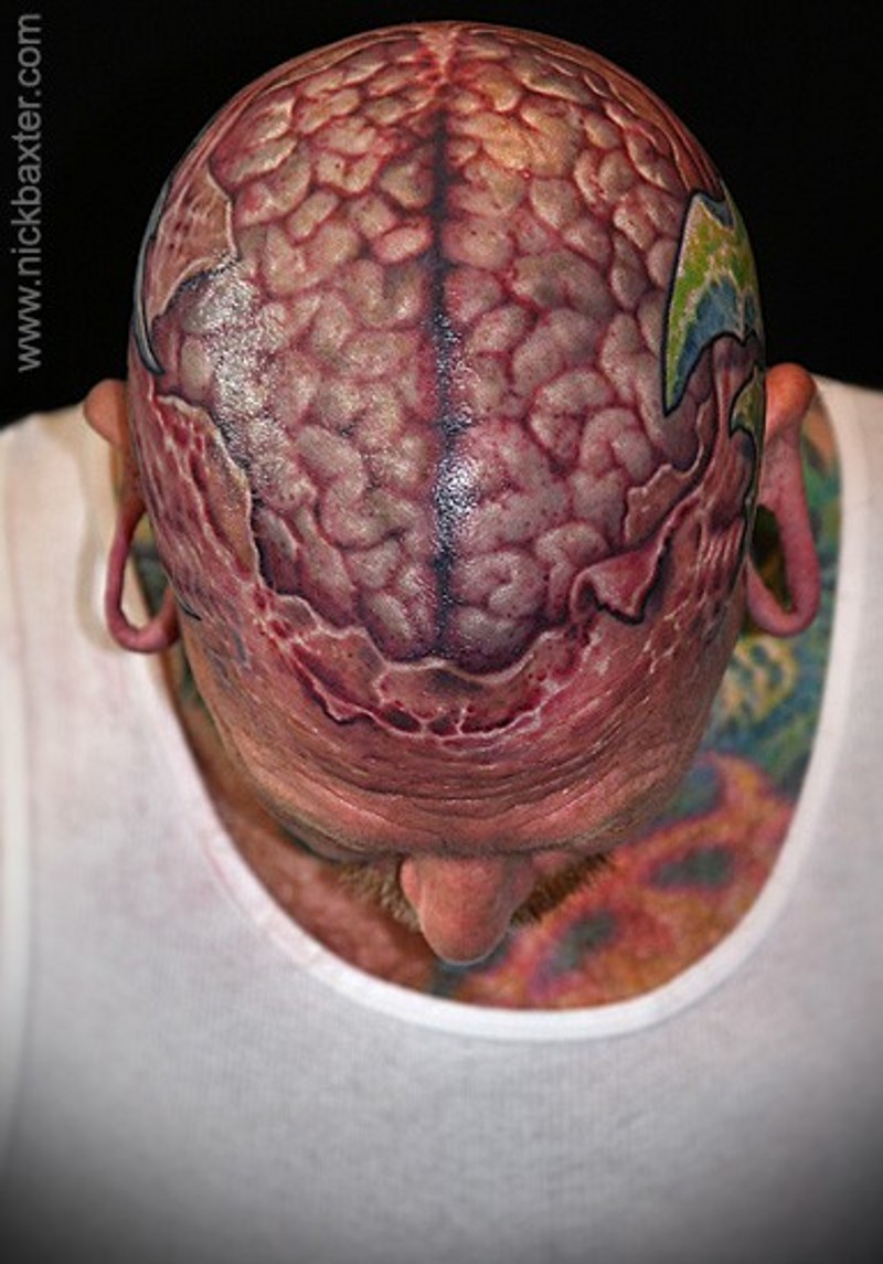 Super realistic naturally colored human brain in torn ripped skin realistic skull tattoo
