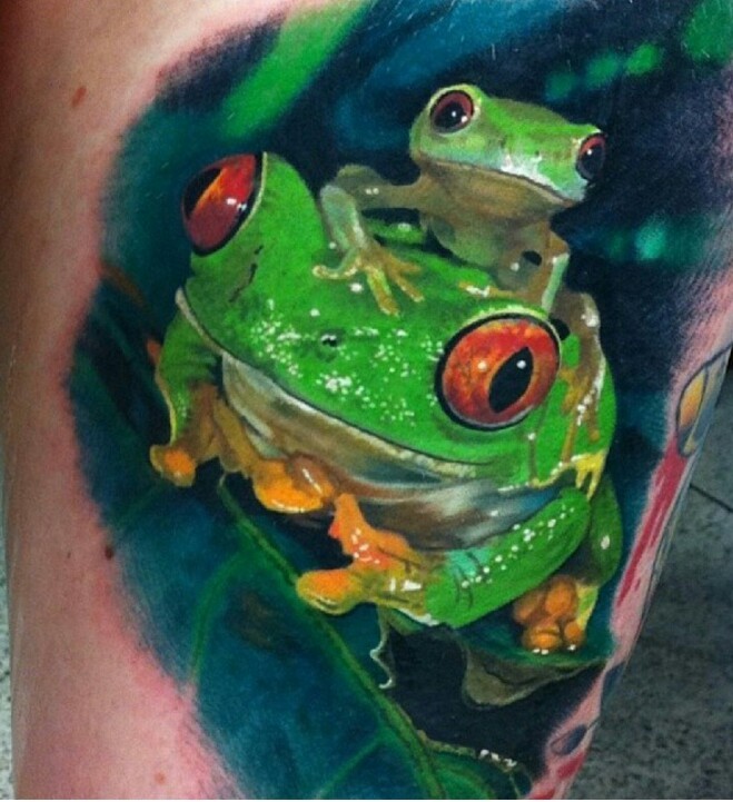 Super realistic watercolor green frogs tattoo