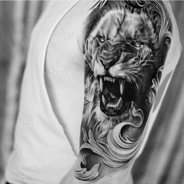 Superior black and white roaring lion shoulder length tattoo