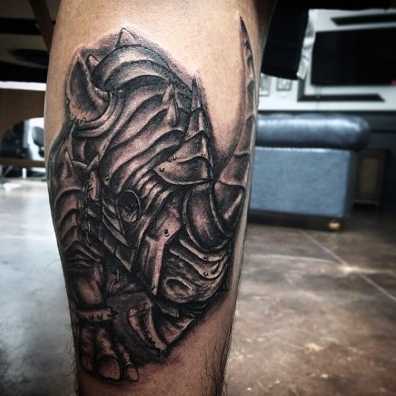 Superior designed detailed pained leg tattoo of armored rhino