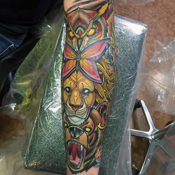 Superior detailed colorful tribal animals statue tattoo on sleeve