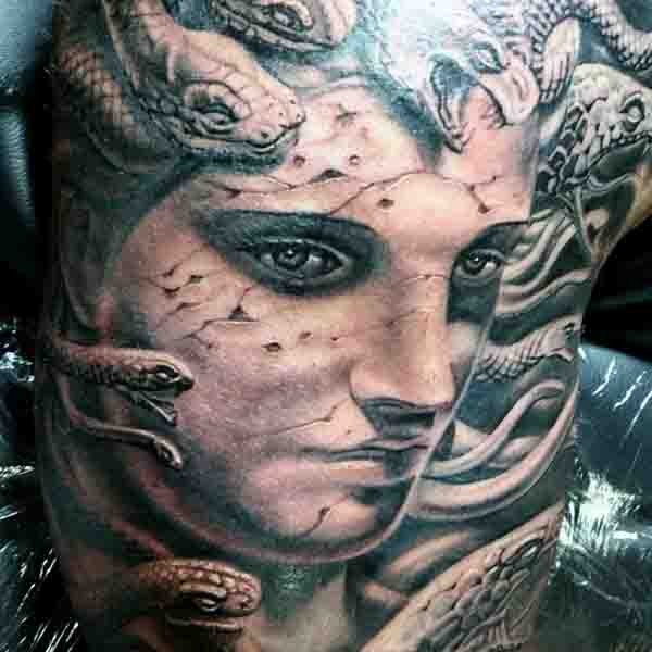 Superior detailed massive black and white corrupted Medusa head tattoo on back