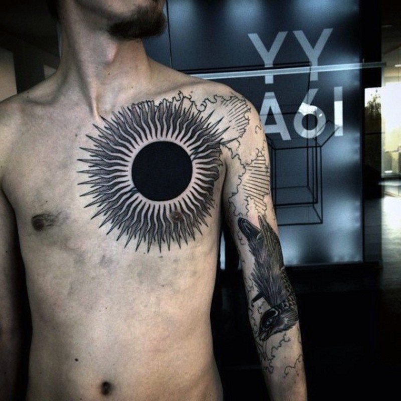Superior massive black and white sun tattoo on chest