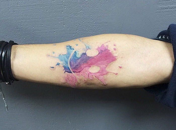 Superior multicolored leg tattoo of water splash