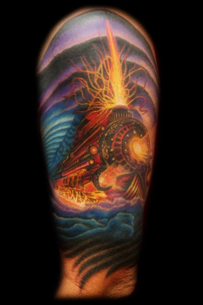 Superior multicolored upper arm tattoo of devils train