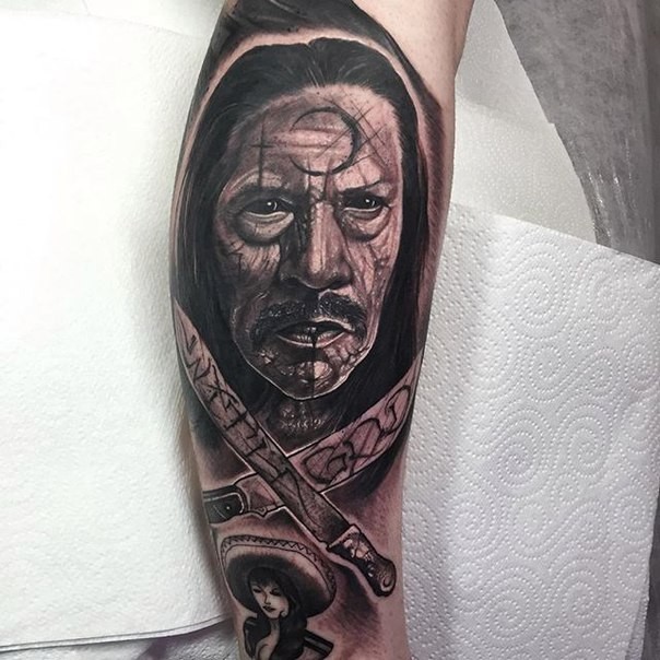 Surprising looking black and white leg tattoo of Machete movie hero
