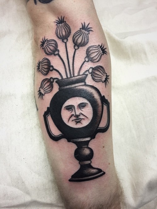 Surrealism style black ink arm tattoo of funny vase with flowers and face