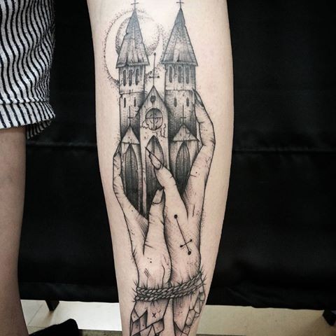 Surrealism style black ink arm tattoo of hands holding castle