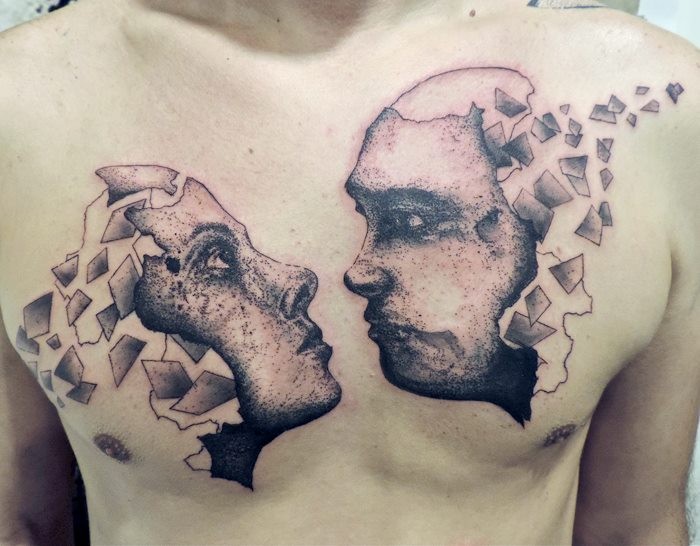 Surrealism style black ink chest tattoo of woman and man