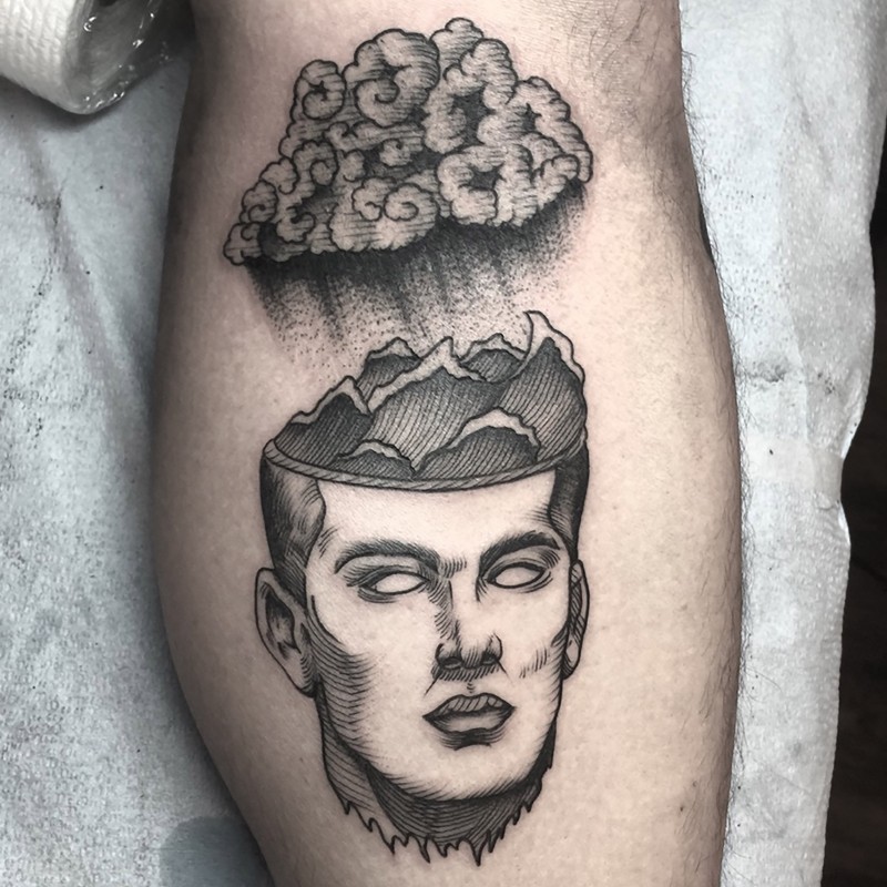 Surrealism style black ink leg tattoo of human head with brain storm