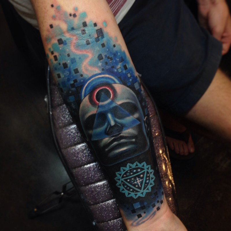 Surrealism style colored forearm tattoo of mystical man face with symbols