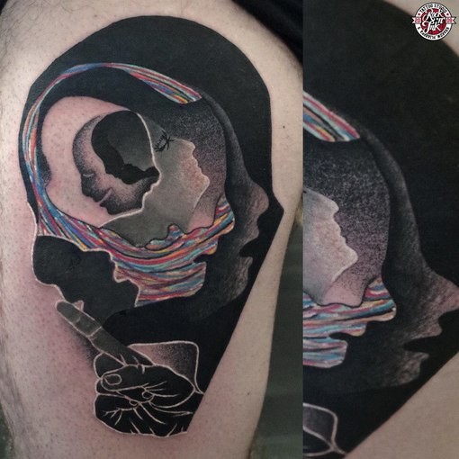 Surrealism style colored man face like tattoo on thigh