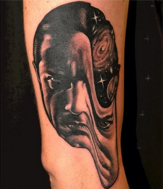 Surrealism style colored man face tattoo stylized with deep space