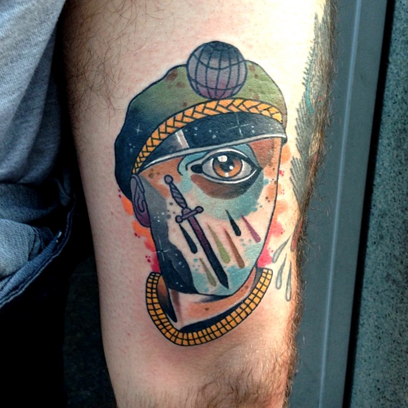 Surrealism style colored thigh tattoo of human face with eye and sword