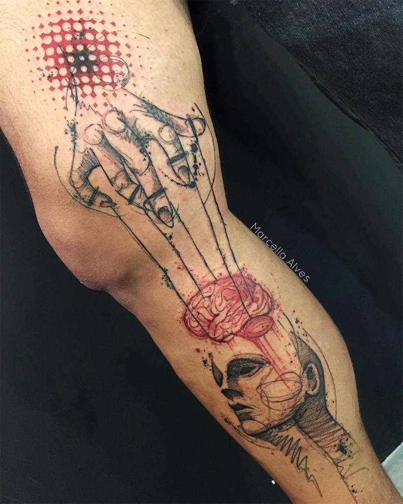 Lo stile surrealista ha colorato il tatuaggio intero della mano umana con il burattino