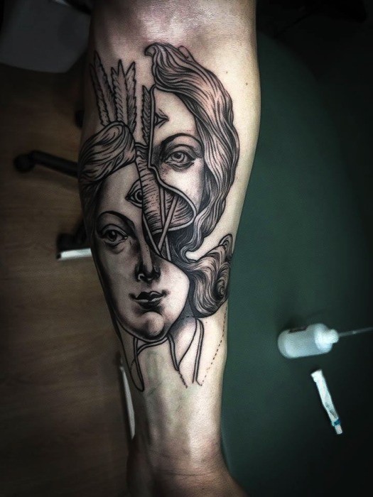 Surrealism style detailed forearm tattoo of divided woman face with arrows