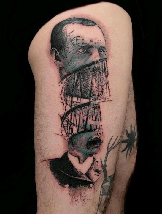 Surrealism style detailed thigh tattoo of divided mans portrait