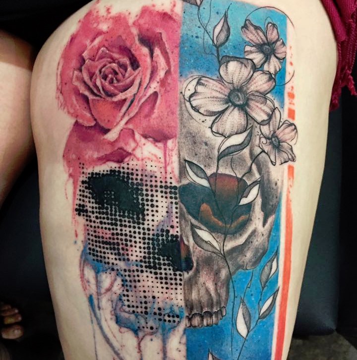 Surrealism style detailed thigh tattoo of skull with various flowers