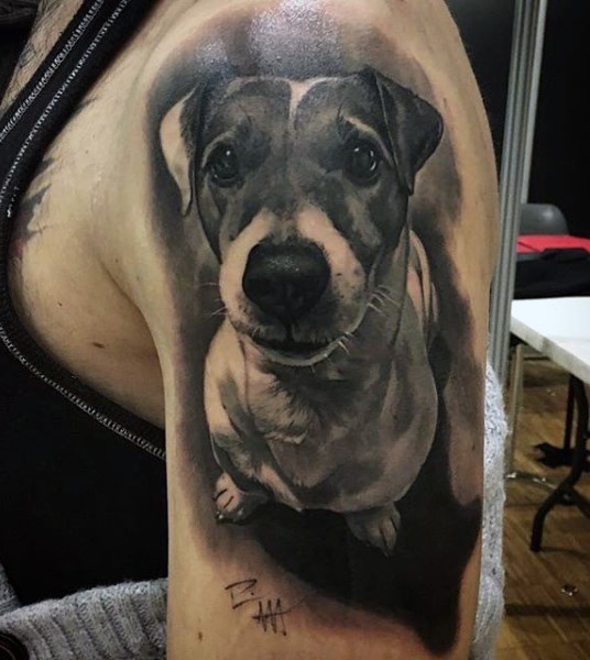 Sweet and cute black and white very realistic dog portrait tattoo on shoulder