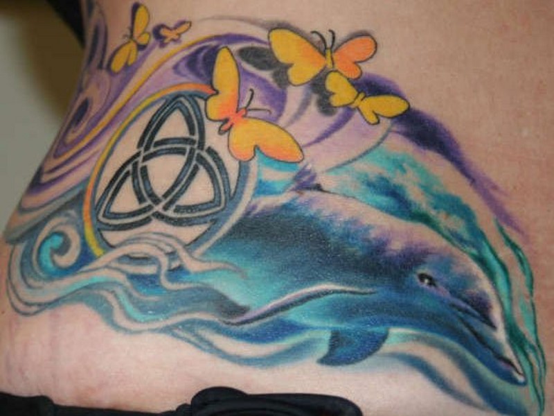 Sweet colored big dolphin with butterflies and Celtic symbol tattoo on waist