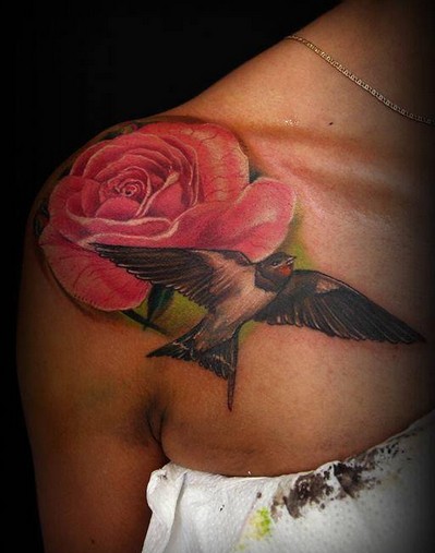 Sweet colored big pink rose with bird tattoo on shoulder