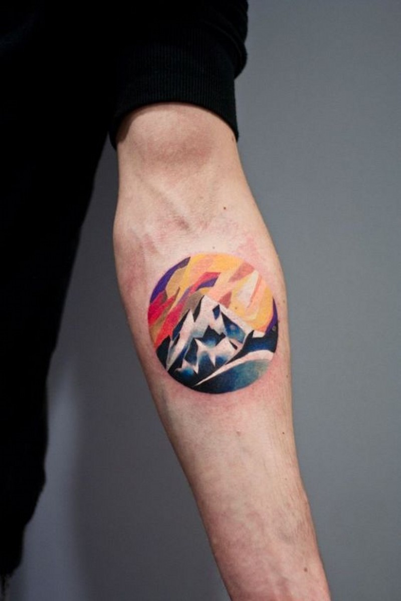 Sweet little colored mountain tattoo on arm