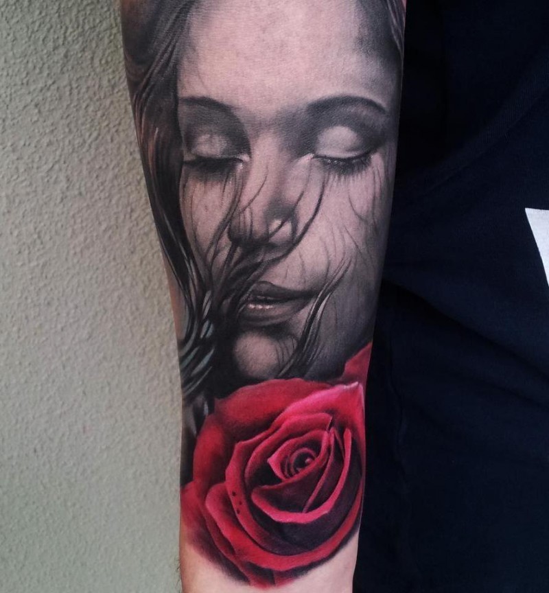 Sweet looking colored arm tattoo of cute woman with red rose