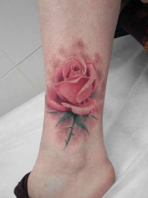 Sweet looking colored leg tattoo of very detailed rose flower