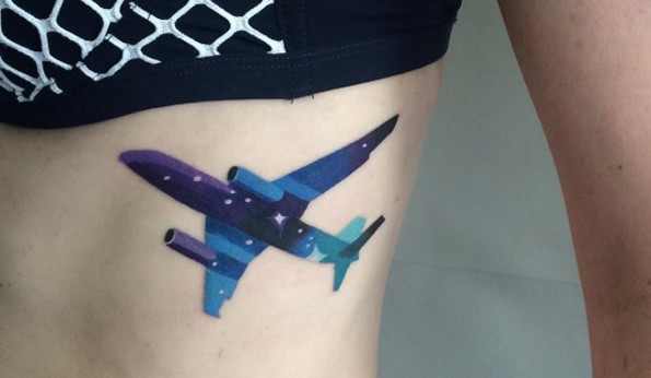 Sweet looking colored side tattoo of big plane